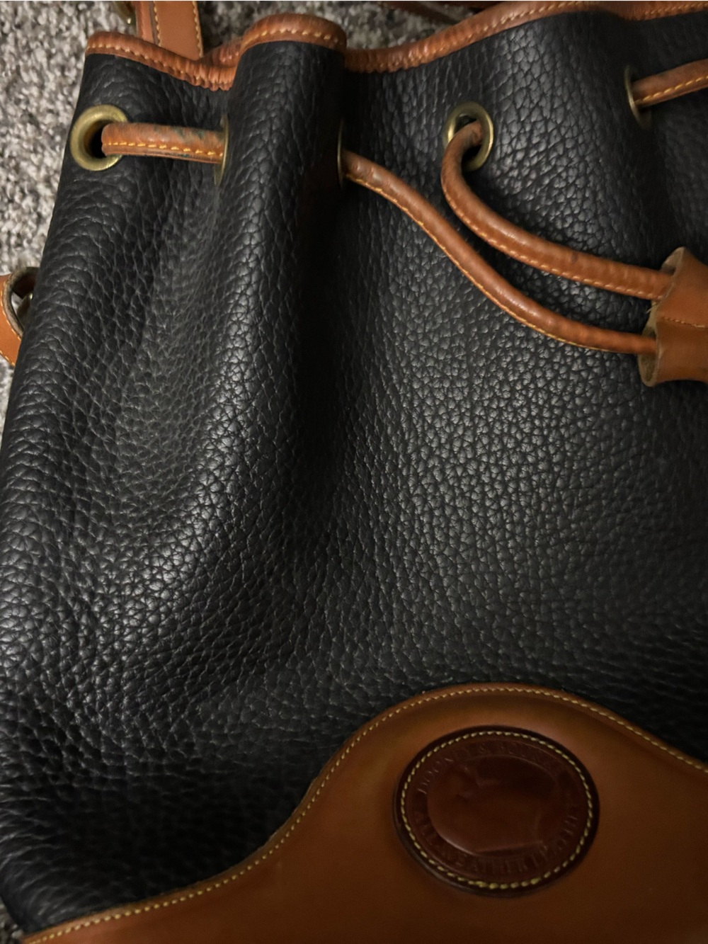 Dooney & Bourke Black and Brown Pebbled Leather Drawstring Backpack